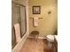 Bathroom with tiled floors, a shower, stool and a decorative painting at 7950 W Flamingo Rd # 2074, Las Vegas, NV 89147