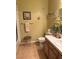 Bathroom with tiled floors, vanity, and a decorative painting at 7950 W Flamingo Rd # 2074, Las Vegas, NV 89147