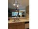 Open-concept kitchen with a view of the living area through a tiled breakfast bar at 7950 W Flamingo Rd # 2074, Las Vegas, NV 89147