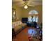 Office with a large window, sofa, ottoman, plants, and natural light at 7950 W Flamingo Rd # 2074, Las Vegas, NV 89147