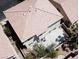 Aerial view of a home with a tile roof and spacious backyard concrete patio at 971 Whispering Grove Ave, Las Vegas, NV 89123