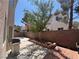 The backyard features a patio, landscaped area, and privacy wall at 971 Whispering Grove Ave, Las Vegas, NV 89123