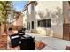 Backyard featuring patio furniture, a grill, and easy access to the home's interior at 971 Whispering Grove Ave, Las Vegas, NV 89123
