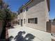 The backyard features a patio, landscaped area, and privacy wall at 971 Whispering Grove Ave, Las Vegas, NV 89123