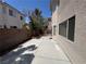 The backyard features a patio, landscaped area, and privacy wall at 971 Whispering Grove Ave, Las Vegas, NV 89123