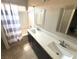 Bathroom featuring double sinks, modern fixtures, and a shower-tub combination at 971 Whispering Grove Ave, Las Vegas, NV 89123