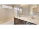 Bathroom featuring a double vanity and a shower and tub combination at 971 Whispering Grove Ave, Las Vegas, NV 89123