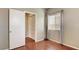 Bedroom with window, closet, hardwood flooring and neutral wall paint at 971 Whispering Grove Ave, Las Vegas, NV 89123