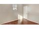 A tidy bedroom with hardwood flooring and a modern window with blinds at 971 Whispering Grove Ave, Las Vegas, NV 89123
