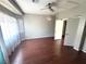 Spacious bedroom with hardwood floors, ample natural light, and an open closet at 971 Whispering Grove Ave, Las Vegas, NV 89123