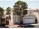 Inviting two-story home with a charming front yard, showcasing its appealing curb appeal at 971 Whispering Grove Ave, Las Vegas, NV 89123