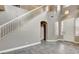 Entryway with tile flooring, high ceilings, a white front door, and a staircase at 971 Whispering Grove Ave, Las Vegas, NV 89123