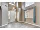 Entryway with tile flooring, high ceilings, a white front door, and a chandelier at 971 Whispering Grove Ave, Las Vegas, NV 89123