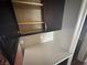 A well-lit kitchen cabinet features ample space for storage at 971 Whispering Grove Ave, Las Vegas, NV 89123