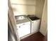 Functional laundry room with a washer, dryer, and storage space at 971 Whispering Grove Ave, Las Vegas, NV 89123