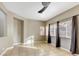 Bright living room with neutral walls, tile floors, and plenty of natural light from the multiple windows at 971 Whispering Grove Ave, Las Vegas, NV 89123