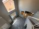 High-angle view of the sunny entryway with grey tile floor and high ceilings and windows at 971 Whispering Grove Ave, Las Vegas, NV 89123