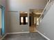 Bright living room features neutral walls, grey tile flooring, and a view of other rooms at 971 Whispering Grove Ave, Las Vegas, NV 89123