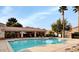 Community pool area with clear blue water, comfortable lounge chairs, and covered seating at 971 Whispering Grove Ave, Las Vegas, NV 89123