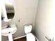 A clean powder room includes a pedestal sink and toilet at 971 Whispering Grove Ave, Las Vegas, NV 89123