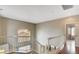 Upstairs landing features wood floors, white railings, and a view of the neighborhood at 971 Whispering Grove Ave, Las Vegas, NV 89123