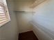 This walk-in closet features built-in shelving and ample storage space at 971 Whispering Grove Ave, Las Vegas, NV 89123