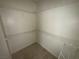 This walk-in closet features built-in shelving and ample storage space at 971 Whispering Grove Ave, Las Vegas, NV 89123