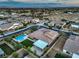 Neighborhood aerial shot highlighting backyard pools, greenery, and the layout of the homes at 9760 Arch Canyon Ct, Las Vegas, NV 89149