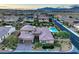 Stunning aerial view of home showcasing the backyard pool and well-manicured landscaping at 9760 Arch Canyon Ct, Las Vegas, NV 89149