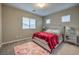 This bedroom is illuminated by natural light and includes carpet flooring and contemporary bedroom furniture at 9760 Arch Canyon Ct, Las Vegas, NV 89149
