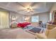Spacious bedroom with a ceiling fan and neutral color scheme at 9760 Arch Canyon Ct, Las Vegas, NV 89149
