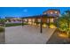 Large covered patio area is perfect for entertaining and enjoys views of the pool and backyard at 9760 Arch Canyon Ct, Las Vegas, NV 89149