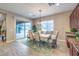 Cozy dining area with views to the outdoor living space, seamlessly flows from the kitchen at 9760 Arch Canyon Ct, Las Vegas, NV 89149