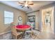 Charming dining area with a round table and ample natural light at 9760 Arch Canyon Ct, Las Vegas, NV 89149