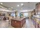 Open kitchen with granite countertops and seamlessly connects to living spaces at 9760 Arch Canyon Ct, Las Vegas, NV 89149