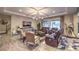 This living room features hardwood floors, coffered ceilings, and bright windows at 9760 Arch Canyon Ct, Las Vegas, NV 89149
