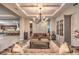 Elegant living room with coffered ceilings, hardwood floors, and stylish furnishings at 9760 Arch Canyon Ct, Las Vegas, NV 89149