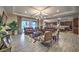 The living room has hardwood floors, coffered ceilings, and large sliding doors to the outdoors at 9760 Arch Canyon Ct, Las Vegas, NV 89149