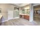 The main bathroom is spacious with a glass enclosed shower, dual sink vanity, and a large walk-in closet at 9760 Arch Canyon Ct, Las Vegas, NV 89149