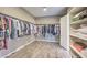 The walk-in closet features a built-in shelving unit and rods for hanging clothes at 9760 Arch Canyon Ct, Las Vegas, NV 89149