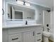 Bathroom features a vanity, a large mirror, and a tub/shower combo at 1013 Cunningham Dr, Las Vegas, NV 89106