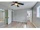The bedroom boasts light, modern flooring and gray walls, with view to bathroom and closet at 1013 Cunningham Dr, Las Vegas, NV 89106
