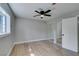 Bedroom features a ceiling fan and sliding door mirror closet at 1013 Cunningham Dr, Las Vegas, NV 89106