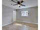 This bedroom features neutral paint and modern ceiling fan, complemented by light-colored laminate flooring at 1013 Cunningham Dr, Las Vegas, NV 89106