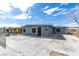 Charming single-story house featuring a gray exterior, a large front yard, and off-street parking at 1013 Cunningham Dr, Las Vegas, NV 89106