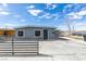 Charming single-story house featuring a gray exterior, a large front yard, and off-street parking at 1013 Cunningham Dr, Las Vegas, NV 89106