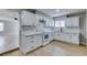 Updated kitchen with white cabinets, subway tile backsplash, and stainless steel appliances at 1013 Cunningham Dr, Las Vegas, NV 89106