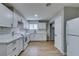 Well-lit kitchen featuring white cabinets, subway tile backsplash, and new appliances at 1013 Cunningham Dr, Las Vegas, NV 89106