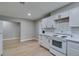 Bright kitchen features white cabinets, subway tile backsplash, and modern countertops at 1013 Cunningham Dr, Las Vegas, NV 89106