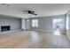 Bright living room featuring new floors, a ceiling fan, a fireplace and lots of natural light at 1013 Cunningham Dr, Las Vegas, NV 89106